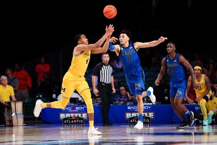 Nov 22, 2023; Paradise Island, BAHAMAS;  Michigan Wolverines guard Nimari Burnett (4) and Memphis Tigers guard Jahvon Quinerly (11) go for the ball during the second half at Imperial Arena. Mandatory Credit: Kevin Jairaj-USA TODAY Sports