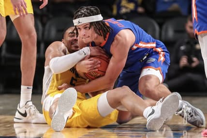 Nov 22, 2023; Brooklyn, New York, USA; Pittsburgh Panthers guard Ishmael Leggett (5) and Florida Gators guard Walter Clayton Jr. (1) battle for a loose ball in the second half at Barclays Center. Mandatory Credit: Wendell Cruz-USA TODAY Sports