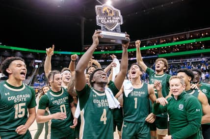 Nov 23, 2023; Kansas City, Missouri, USA; against the Colorado State Rams hold up the championship trophy after the game against the Creighton Bluejays at T-Mobile Center. Mandatory Credit: William Purnell-USA TODAY Sports