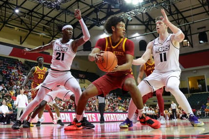 Nov 23, 2023; Kissimmee, Florida, USA;  Iowa State Cyclones guard Curtis Jones (5) look to pass the ball guarded by Virginia Commonwealth Rams forward Christian Fermin (21) and guard Max Shulga (11) in the first half  in the first half during the ESPN Events Invitational at State Farm Field House. Mandatory Credit: Nathan Ray Seebeck-USA TODAY Sports