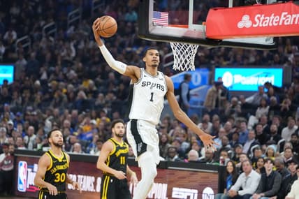 November 24, 2023; San Francisco, California, USA; San Antonio Spurs center Victor Wembanyama (1) dunks the basketball against Golden State Warriors guard Stephen Curry (30) and guard Klay Thompson (11) during the first quarter at Chase Center. Mandatory Credit: Kyle Terada-USA TODAY Sports