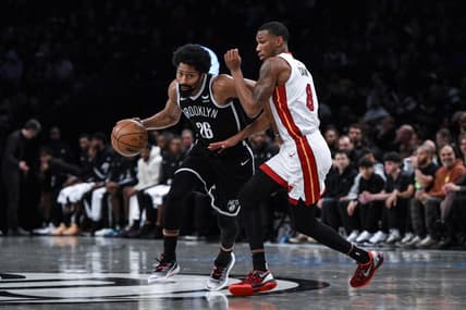 Nov 25, 2023; Brooklyn, New York, USA; Brooklyn Nets guard Spencer Dinwiddie (26) drives against Miami Heat forward Jamal Cain (8) during the third quarter at Barclays Center. Mandatory Credit: John Jones-USA TODAY Sports