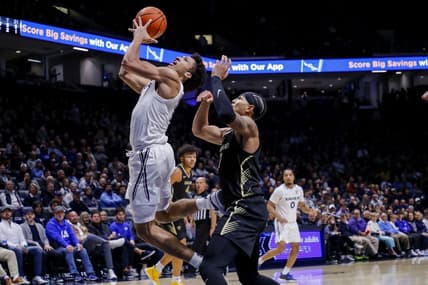 Nov 27, 2023; Cincinnati, Ohio, USA; Xavier Musketeers guard Desmond Claude (1) shoots against Oakland Golden Grizzlies guard Isaiah Jones (7) in the first half at Cintas Center. Mandatory Credit: Katie Stratman-USA TODAY Sports