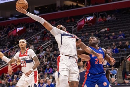 Nov 27, 2023; Detroit, Michigan, USA; Detroit Pistons center Isaiah Stewart (28) and Washington Wizards center Daniel Gafford (21) battle for the ball during the first half at Little Caesars Arena. Mandatory Credit: David Reginek-USA TODAY Sports