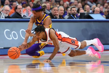 Nov 28, 2023; Syracuse, New York, USA; Syracuse Orange guard Judah Mintz (3) and LSU Tigers guard Mike Williams III (2) battle for a loose ball during the first half at the JMA Wireless Dome. Mandatory Credit: Rich Barnes-USA TODAY Sports