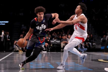 Nov 28, 2023; Brooklyn, New York, USA; Brooklyn Nets forward Cameron Johnson (2) controls the ball against Toronto Raptors forward Scottie Barnes (4) during the second quarter at Barclays Center. Mandatory Credit: Brad Penner-USA TODAY Sports
