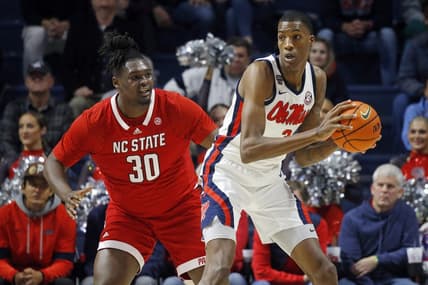Nov 28, 2023; Oxford, Mississippi, USA; Mississippi Rebels forward Jamarion Sharp (3) handles the ball as North Carolina State Wolfpack forward DJ Burns, Jr. (30) defends during the first half at The Sandy and John Black Pavilion at Ole Miss. Mandatory Credit: Petre Thomas-USA TODAY Sports