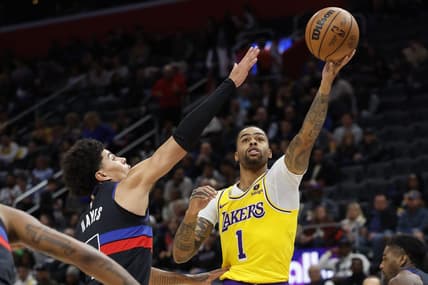 Nov 29, 2023; Detroit, Michigan, USA; Los Angeles Lakers guard D'Angelo Russell (1) shoots on Detroit Pistons guard Killian Hayes (7) in the first half at Little Caesars Arena. Mandatory Credit: Rick Osentoski-USA TODAY Sports