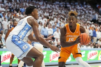 Nov 29, 2023; Chapel Hill, North Carolina, USA; Tennessee Volunteers guard Jahmai Mashack (15) looks to pass as North Carolina Tar Heels forward Harrison Ingram (55) defends in the first half at Dean E. Smith Center. Mandatory Credit: Bob Donnan-USA TODAY Sports