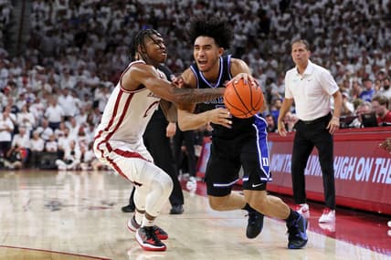 Nov 29, 2023; Fayetteville, Arkansas, USA; Duke Blue Devils guard Jared McCain (0) is fouled by Arkansas Razorbacks Khalif Battle (0) during the first half at Bud Walton Arena. Mandatory Credit: Nelson Chenault-USA TODAY Sports