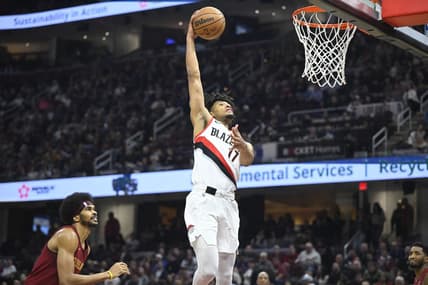 Nov 30, 2023; Cleveland, Ohio, USA; Portland Trail Blazers guard Shaedon Sharpe (17) dunks beside Cleveland Cavaliers center Jarrett Allen (31) in the second quarter at Rocket Mortgage FieldHouse. Mandatory Credit: David Richard-USA TODAY Sports