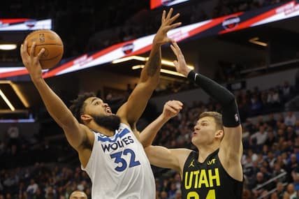 Nov 30, 2023; Minneapolis, Minnesota, USA; Minnesota Timberwolves forward Karl-Anthony Towns (32) shoots against Utah Jazz center Walker Kessler (24) in the first quarter at Target Center. Mandatory Credit: Bruce Kluckhohn-USA TODAY Sports