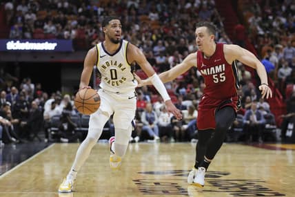 Nov 30, 2023; Miami, Florida, USA; Indiana Pacers guard Tyrese Haliburton (0) drives to the basket against Miami Heat forward Duncan Robinson (55) during the second quarter at Kaseya Center. Mandatory Credit: Sam Navarro-USA TODAY Sports