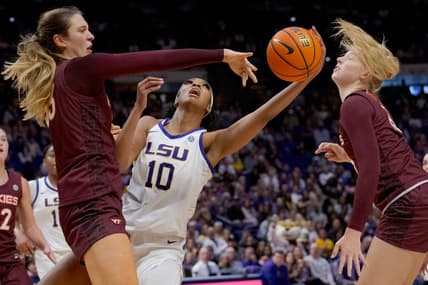 Nov 30, 2023; Baton Rouge, Louisiana, USA; Virginia Tech Hokies center Elizabeth Kitley (33) blocks the shot of LSU Lady Tigers forward Angel Reese (10) next Virginia Tech Hokies center Clara Strack (13) during the first half  at Pete Maravich Assembly Center. Mandatory Credit: Matthew Hinton-USA TODAY Sports