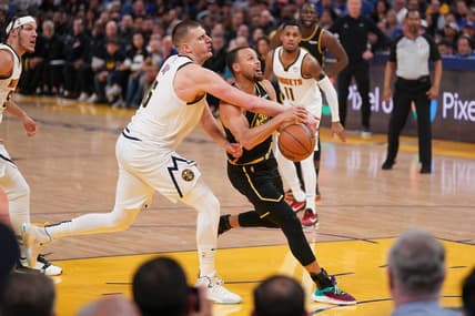 Apr 27, 2022; San Francisco, California, USA; Golden State Warriors guard Stephen Curry (30) has the ball knocked out of his hands by Denver Nuggets center Nikola Jokic (15) in the third quarter during game five of the first round for the 2022 NBA playoffs at Chase Center. Mandatory Credit: Cary Edmondson-USA TODAY Sports