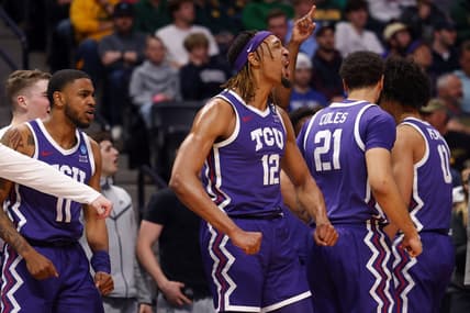 Mar 19, 2023; Denver, CO, USA; TCU Horned Frogs forward Xavier Cork (12) and guard Rondel Walker (11) and forward JaKobe Coles (21) celebrate on the bench in the first half against the Gonzaga Bulldogs at Ball Arena. Mandatory Credit: Michael Ciaglo-USA TODAY Sports