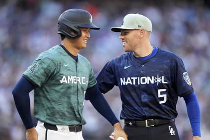 Jul 11, 2023; Seattle, Washington, USA; American League designated hitter/pitcher  Shohei Ohtani  of the Los Angeles Angels of Anaheim (17) reacts with National League first baseman  Freddie Freeman  of the Los Angeles Dodgers (5) during the fifth inning at T-Mobile Park. Mandatory Credit: Stephen Brashear-USA TODAY Sports