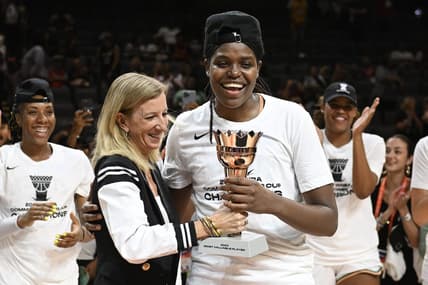 Aug 15, 2023; Las Vegas, Nevada, USA; WNBA Commissioner Cathy Engelbert hands New York Liberty forward Jonquel Jones the MVP trophy for the Commissioner   s Cup Championship game after defeating the Las Vegas Aces at Michelob Ultra Arena. Mandatory Credit: Candice Ward-USA TODAY Sports