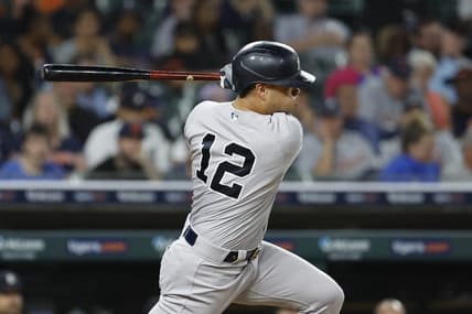 Aug 28, 2023; Detroit, Michigan, USA;  New York Yankees center fielder Isiah Kiner-Falefa (12) hits a single in the eighth inning against the Detroit Tigers at Comerica Park. Mandatory Credit: Rick Osentoski-USA TODAY Sports