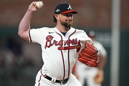 Oct 9, 2023; Cumberland, Georgia, USA; Atlanta Braves relief pitcher Kirby Yates (22) pitches during the fifth inning against the Philadelphia Phillies in game two of the NLDS for the 2023 MLB playoffs at Truist Park. Mandatory Credit: Dale Zanine-USA TODAY Sports