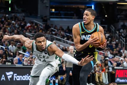 Nov 9, 2023; Indianapolis, Indiana, USA; Indiana Pacers guard Tyrese Haliburton (0) dribbles the ball while Milwaukee Bucks forward Giannis Antetokounmpo (34) defends in the second half at Gainbridge Fieldhouse. Mandatory Credit: Trevor Ruszkowski-USA TODAY Sports