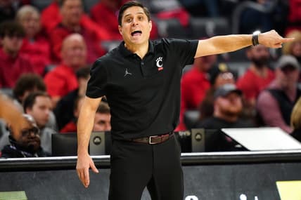 Cincinnati Bearcats head coach Wes Miller instructs the team in the second half during an NCAA college basketball game between Georgia Tech Yellow Jackets and the Cincinnati Bearcats, Wednesday, Nov. 22, 2023, at Fifth Third Arena in Cincinnati.