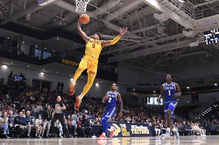 Nov 23, 2023; La Jolla, California, USA; USC Trojans guard Boogie Ellis (5) goes to the basket ahead of Seton Hall Pirates guard Al-Amir Dawes (2) and guard Kadary Richmond (1) during the first half at LionTree Arena. Mandatory Credit: Orlando Ramirez-USA TODAY Sports