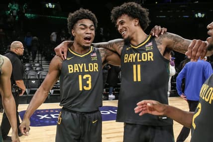 Nov 24, 2023; Brooklyn, NY, USA;  Baylor Bears guard Langston Love (13) and forward Jalen Bridges (11) celebrate after beating the Florida Gators to win the NIT Season Tip-Off Championship at Barclay Center. Mandatory Credit: Wendell Cruz-USA TODAY Sports