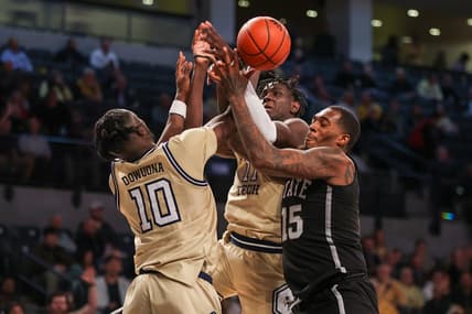 Nov 28, 2023; Atlanta, Georgia, USA; Georgia Tech Yellow Jackets forward Ebenezer Dowuona (10) and forward Baye Ndongo (11) reach for a rebound with Mississippi State Bulldogs forward Jimmy Bell Jr. (15) in the second half at McCamish Pavilion. Mandatory Credit: Brett Davis-USA TODAY Sports
