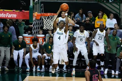 Nov 28, 2023; Waco, Texas, USA;  Baylor Bears guard Ja'Kobe Walter (4) dunks against the Nicholls State Colonels during the second half at Ferrell Center. Mandatory Credit: Chris Jones-USA TODAY Sports