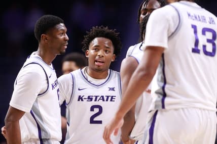 Kansas State graduate transfer guard Tylor Perry (2) brings in his teammates to a huddle during overtime of Tuesday's game against Oral Roberts inside Bramlage Coliseum.