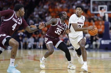 Nov 29, 2023; Charlottesville, Virginia, USA; Virginia Cavaliers guard Reece Beekman (2) drives to the basket past Texas A&M Aggies guard Manny Obaseki (35) in the second half at John Paul Jones Arena. Mandatory Credit: Geoff Burke-USA TODAY Sports