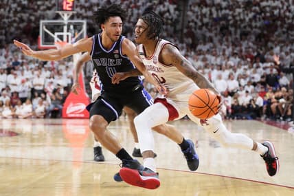 Nov 29, 2023; Fayetteville, Arkansas, USA; Arkansas Razorbacks guard Khalif Battle (0) drives against Duke Blue Devils Jared McCain (0) during the second half at Bud Walton Arena. Arkansas won 80-75. Mandatory Credit: Nelson Chenault-USA TODAY Sports