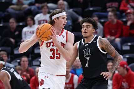 Nov 30, 2023; Salt Lake City, Utah, USA; Utah Utes center Branden Carlson (35) looks to pass the ball against Hawaii Warriors forward Justin McKoy (1) during the first half at Delta Center. Mandatory Credit: Rob Gray-USA TODAY Sports
