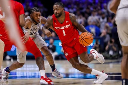 Dec 1, 2023; Cincinnati, Ohio, USA; Houston Cougars guard Jamal Shead (1) dribbles against Xavier Musketeers guard Dayvion McKnight (20) in the first half at Cintas Center. Mandatory Credit: Katie Stratman-USA TODAY Sports