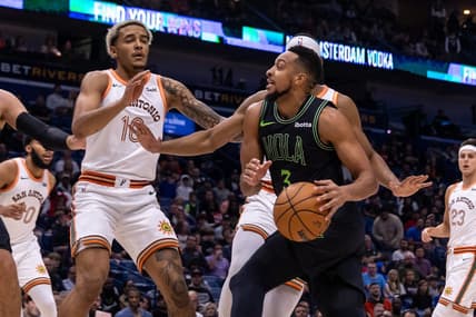 Dec 1, 2023; New Orleans, Louisiana, USA; New Orleans Pelicans guard CJ McCollum (3) dribbles against San Antonio Spurs guard Malaki Branham (22) during the first half at the Smoothie King Center. Mandatory Credit: Stephen Lew-USA TODAY Sports