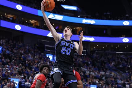 Dec 1, 2023; Salt Lake City, Utah, USA; Brigham Young Cougars guard Spencer Johnson (20) lays the ball up against the Fresno State Bulldogs during the first half at Delta Center. Mandatory Credit: Rob Gray-USA TODAY Sports