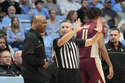 Dec 2, 2023; Chapel Hill, North Carolina, USA;  Florida State Seminoles head coach Leonard Hamilton with the official in the first half at Dean E. Smith Center. Mandatory Credit: Bob Donnan-USA TODAY Sports