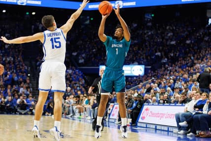 Dec 2, 2023; Lexington, Kentucky, USA; North Carolina-Wilmington Seahawks guard Donovan Newby (1) shoots the ball against Kentucky Wildcats guard Reed Sheppard (15) during the first half at Rupp Arena at Central Bank Center. Mandatory Credit: Jordan Prather-USA TODAY Sports