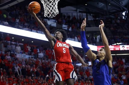 Dec 2, 2023; Oxford, Mississippi, USA; Mississippi Rebels guard Jaylen Murray (5) drives to the basket against Memphis Tigers forward Nicholas Jourdain (2) during the second half at The Sandy and John Black Pavilion at Ole Miss. Mandatory Credit: Petre Thomas-USA TODAY Sports