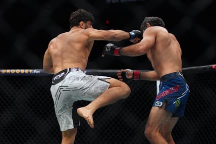 Dec 2, 2023; Austin, Texas, USA; Beneil Dariush (red gloves) fights Arman Tsarukyan (blue gloves) during UFC Fight Night at Moody Center. Mandatory Credit: Dustin Safranek-USA TODAY Sports