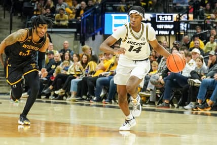 Dec 3, 2023; Columbia, Missouri, USA; Missouri Tigers guard Anthony Robinson II (14) steals the ball and dribbles as Wichita State Shockers guard Colby Rogers (4) defends during the first half at Mizzou Arena. Mandatory Credit: Denny Medley-USA TODAY Sports