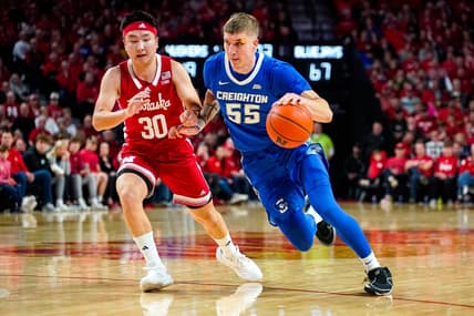 Dec 3, 2023; Lincoln, Nebraska, USA; Creighton Bluejays guard Baylor Scheierman (55) drives against Nebraska Cornhuskers guard Keisei Tominaga (30) during the second half at Pinnacle Bank Arena. Mandatory Credit: Dylan Widger-USA TODAY Sports