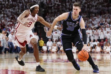 Nov 29, 2023; Fayetteville, Arkansas, USA; Duke Blue Devils center Kyle Filipowski (30) during the first half as Arkansas Razorbacks Chandler Lawson (8) defends at Bud Walton Arena. Arkansas won 80-75. Mandatory Credit: Nelson Chenault-USA TODAY Sports