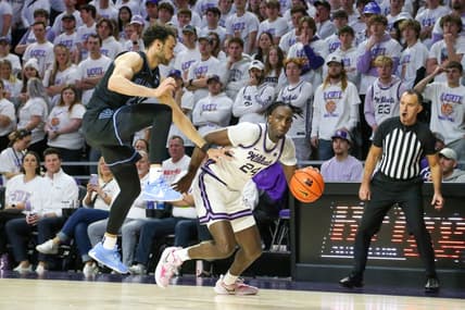 Dec 5, 2023; Manhattan, Kansas, USA; Kansas State Wildcats forward Arthur Maluma (24) dribbles by Villanova Wildcats forward Tyler Burton (23) during the first half at Bramlage Coliseum. Mandatory Credit: Scott Sewell-USA TODAY Sports