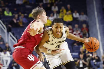 Dec 5, 2023; Ann Arbor, Michigan, USA;  Michigan Wolverines guard Nimari Burnett (4) dribbles against Indiana Hoosiers guard Gabe Cupps (2) in the first half at Crisler Center. Mandatory Credit: Rick Osentoski-USA TODAY Sports