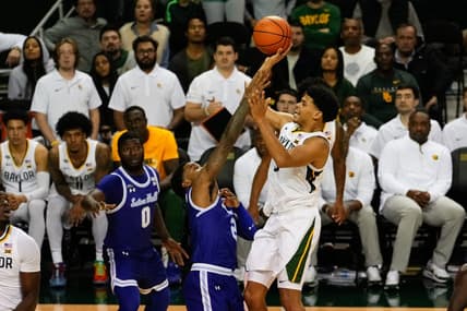 Dec 5, 2023; Waco, Texas, USA; Baylor Bears guard RayJ Dennis (10) shoots and is fouled by Seton Hall Pirates guard Al-Amir Dawes (2) during the second half at Ferrell Center. Mandatory Credit: Chris Jones-USA TODAY Sports