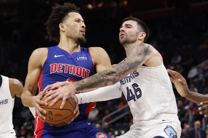 Dec 6, 2023; Detroit, Michigan, USA;  Memphis Grizzlies guard John Konchar (46) strips the ball from Detroit Pistons guard Cade Cunningham (2) in the first half at Little Caesars Arena. Mandatory Credit: Rick Osentoski-USA TODAY Sports