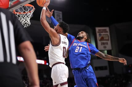 Dec 6, 2023; College Station, Texas, USA; Texas A&M Aggies guard Jace Carter (0) shoots an inside shot against DePaul Blue Demons forward Da'Sean Nelson (21) during the first half at Reed Arena. Mandatory Credit: Erik Williams-USA TODAY Sports