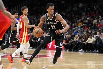Dec 6, 2023; Atlanta, Georgia, USA; Brooklyn Nets center Nic Claxton (33) controls the ball against the Atlanta Hawks during the second half at State Farm Arena. Mandatory Credit: Dale Zanine-USA TODAY Sports